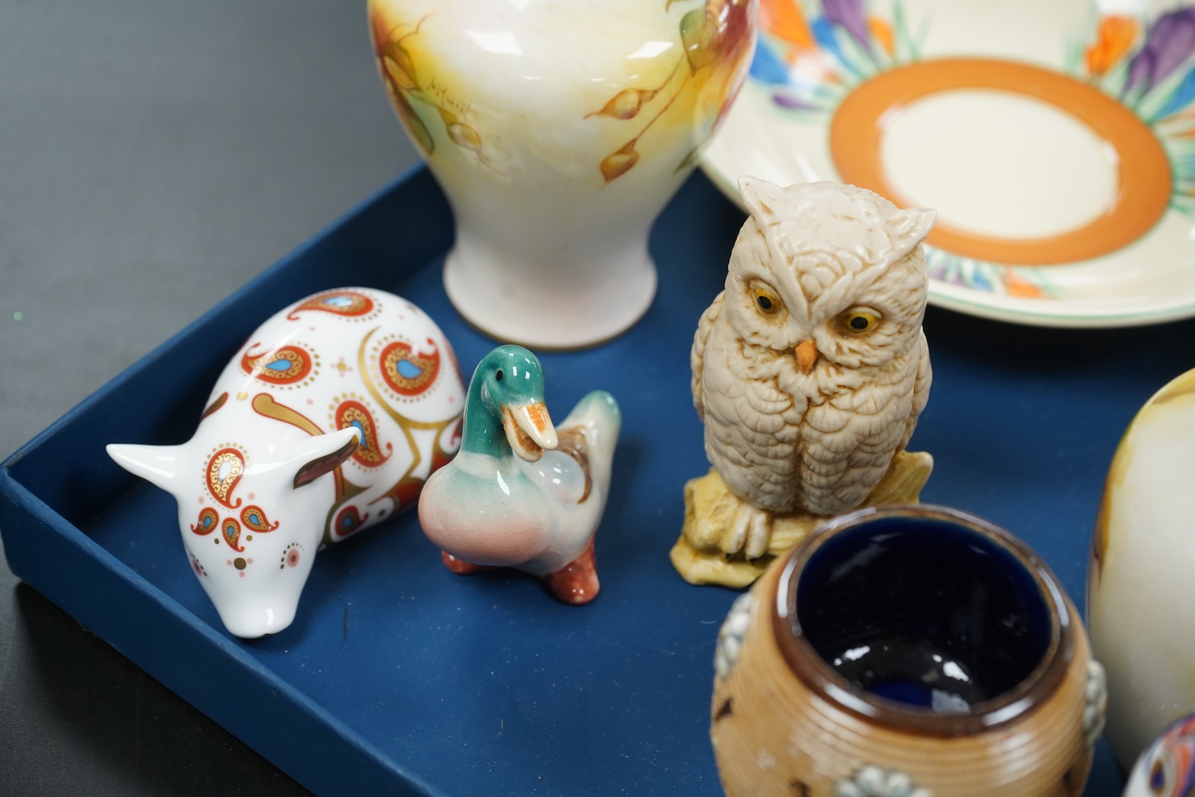 A collection of mixed porcelain and pottery to include four Worcester vases, one signed H. Blake, Clarice Cliff crocus pattern cup, saucer and sugar bowl and two Doulton Imari paperweights, largest 13cm high